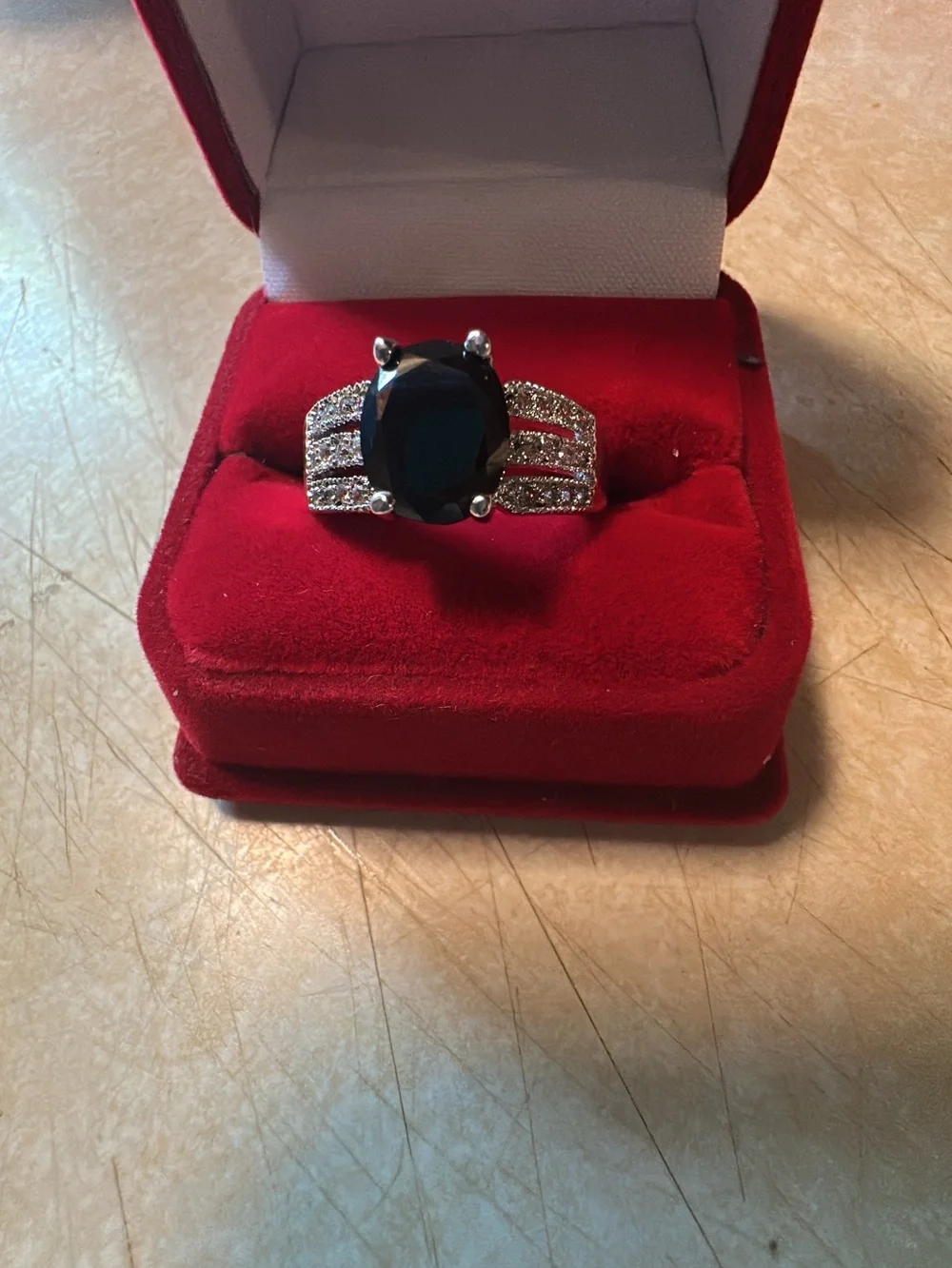 Silvertone  Ring with Black Oval Stone and Pavé Accents